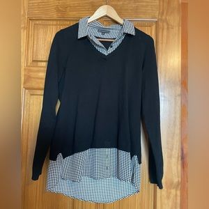 Sweater over blouse joined together.